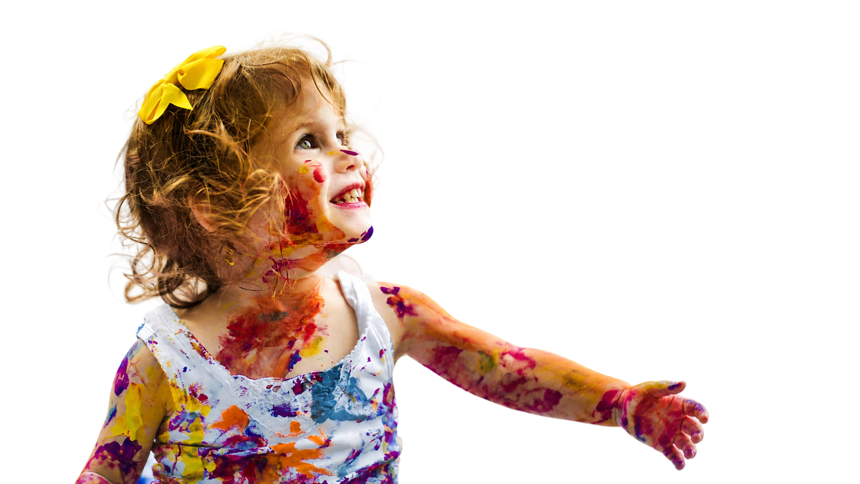 A young child smiling joyfully.